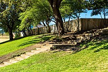 The wooden fence on the grassy knoll