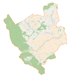 Mapa konturowa gminy Stoszowice, blisko centrum u góry znajduje się punkt z opisem „Pałac w Rudnicy”