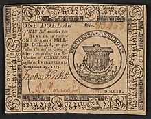 A one-dollar note issued by the Second Continental Congress in 1775 with the inscription: "ONE DOLLAR. THIS Bill entitles the BEARER to receive ONE SPANISH MILLED DOLLAR, or the Value thereof in Gold or Silver, according to a Resolution of CONGRESS, passed at Philadelphia November 29, 1775.." ; Within border cuts: "Continental Currency" and "The United Colonies". ; Within circle: "DEPRESSA RESURGIT". ; Verso: "ONE DOLLAR. PHILADELPHIA: Printed by HALL and SELLERS. 1775."