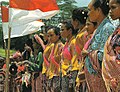 Image 71Timorese women with the Indonesian national flag (from History of Indonesia)