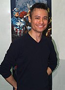 Artist Jim Cheung at a convention in 2016