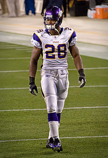 Peterson in full uniform walking on the field