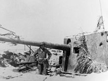 Japanese 14-cm gun emplacement on Tarawa 1943; note the holes in the gun shield