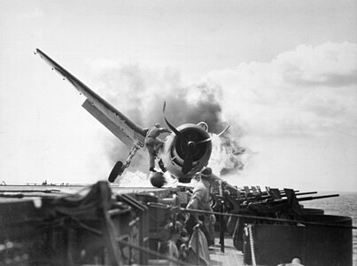 F6F Hellcat burning after crash landing on USS Enterprise, by the United States Navy