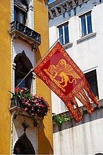A modern-day replica of the flag flown from a balcony in Venice