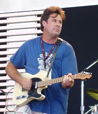 Singer Vince Gill, playing an electric guitar.