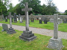 The three cross shaped gravestones of the Clare family at Bretherton Church