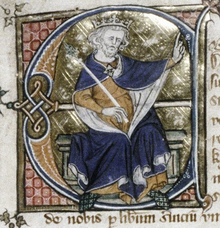 Front-view of a seated Edward, wearing a crown and holding a sceptre, pointing to something with his left hand
