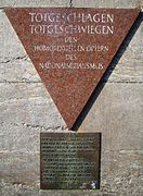 This pink triangle plaque in the Berlin Nollendorfplatz subway station honors gay male victims