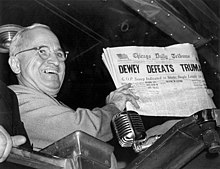 Truman holding Chicago Daily Tribune with erroneous headline "Dewey Defeats Truman"