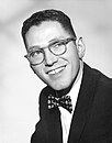 Tom Lehrer, retired musician and satirist. Lectured in American studies, Mathematics, and Musical Theater.