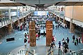 "Musqueam welcome figures" by Susan A. Point in the International Arrivals hall of Vancouver International Airport