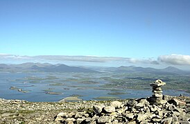 Cairn near summit with view of Clew Bay and Mayo mountains