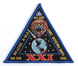 A triangular fabric patch labeled "XXI"