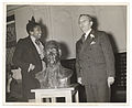 Burke, left, presenting her bust of Samuel Huntington (1938) to the principal of Samuel Huntington Junior High School in Jamaica, Queens