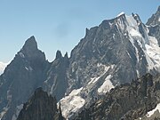 The Peuterey Ridge on the Mt. Blanc massif. From left to right Aiguille Noire de Peuterey (3773 m), Brèche-sud (3429 m), the Dames Anglaises (3601 m), Brèche-central, L'Isolée, Brèche-nord (3491 m), Aiguille Blanche de Peuterey (4112 m) and Col de Peuterey (3934 m)