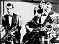 Image 13Bill Haley and his Comets performing in the 1954 Universal International film Round Up of Rhythm (from Rock and roll)