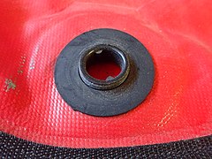 Buoyancy compensator internal fitting and gasket for filling hose or dump valve in place