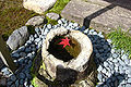 Stone water basin in Kenroku-en garden.
