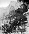 Image 8 1895 train wreck, Gare Montparnasse Photo credit: Studio Lévy and Sons On October 22, 1895, the Granville–Paris Express train overran the buffer stop at Gare Montparnasse station. The engine careened across almost 30 metres (100 feet) of the station concourse, crashed through a 60 centimetre thick wall, shot across a terrace and sailed out of the station, plummeting onto the Place de Rennes 10 metres (30 feet) below where it stood on its nose. While all of the passengers on board the train survived, one woman on the street below was killed by falling masonry. More featured pictures