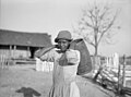 Annie Pettway Bendolph carrying water. Gee's Bend, Alabama. April 1937. Photographed by Arthur Rothstein.