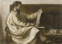 A bearded artist in a long smock sits sideways on a high-backed wooden bench. In his left hand he holds a small board on which he sculpting a relief