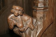 Statuette of a wet nurse forming part of a parclose screen in the Basilica of Saint Maternus, Walcourt, Belgium