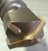Rebar resistant bit with four carbide cutters