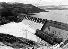 Grand Coulee Dam with water coming over central spillway