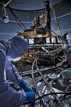 The Beam Image Analyzer is shown, being prepared to test OSIM under a cryogenic vacuum, 2012.[35]