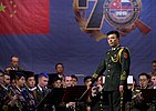 Band director Zhang Haifeng conducting a group of musicians in the Military Band of the Western Military District.