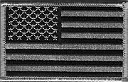 A subdued-color flag patch, similar to the style worn on the United States Army's ACU uniform. The patch is customarily worn reversed on the right upper sleeve.