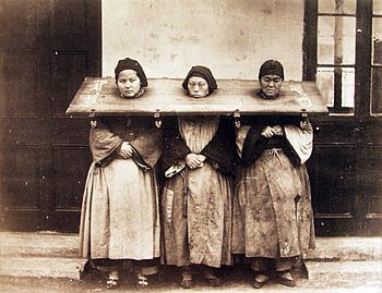 Three women in the pillory, China, 1875