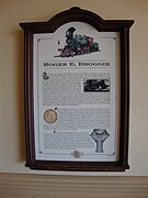 A plaque representing information about a green steam locomotive