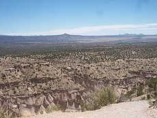 Tent rocks, with Cochiti Pueblo lands and the Rio Grande in the distance
