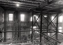 Inside of a building being renovated, with scaffolding