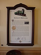 A plaque representing information about a green steam locomotive