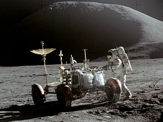 Astronaut works on the Moon at the lunar rover