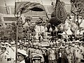 Proceeding from the Grand Palace to the Temple of the Emerald Buddha on 5 May 1950, King Bhumibol Adulyadej wears the Gold-Woven Gown (ครุยกรองทอง; Khrui Krong Thong). Part of the Coronation of the Thai monarch.