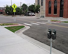 Curb extension at a mid-block pedestrian crossing