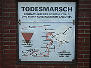 A red triangle on a historical marker. The marker shows the route prisoners were forced to take on the Buchenwald death march (Todesmarsch).
