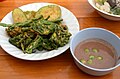 Nam phrik kapi served with vegetable fritters; a common dish in Thai cuisine