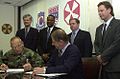 Image 32National Federation of Federal Employees officials sign a collective bargaining agreement with the U.S. 8th Army in October 2002.