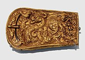 A golden belt buckle with dragon motif, Western Han