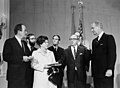 Cohen being sworn in as the Secretary of Health, Education and Welfare; from left to right: President Lyndon B. Johnson (far right), Vice-President Hubert H. Humphrey (far left), and the Eloise B. Cohen (right) and the three sons in 1968.