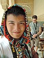 A Chinese man with headscarf in his fashion costume.