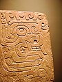 Chavín stela depicting a brindle face. National Museum Chavín de Huántar.