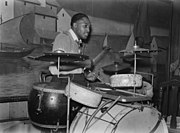 Unnamed drummer, 1939, note the nearest three cymbals have no tilit buttons, upper felts or wingnuts
