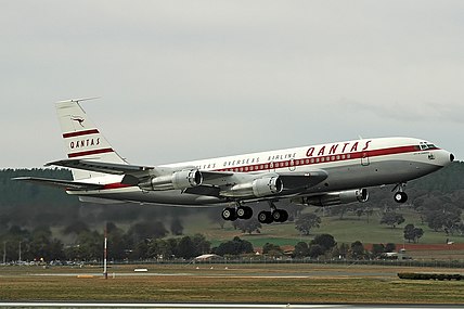 Boeing 707 with "Red Stripe" livery featuring red wordmark on whitetail and red cheatline, livery used 1959–1961. Piston aircraft wore a similar, but identical livery from 1955 to 1959.