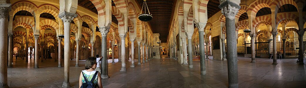 These arcades in Córdoba were begun in the 780s; Some are topped by beams, others by barrel vaults.